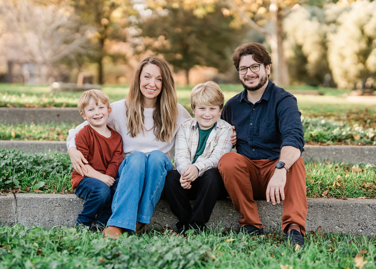 Judy Ennis with her family on the steps of a park in Davis