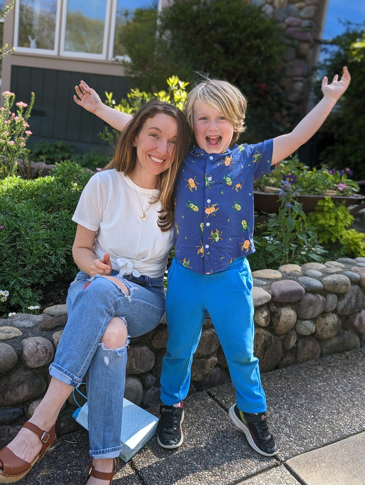 Judy with her son in front of their Davis home