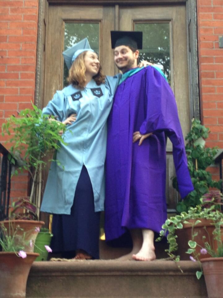 Judy and her husband in graduation gowns
