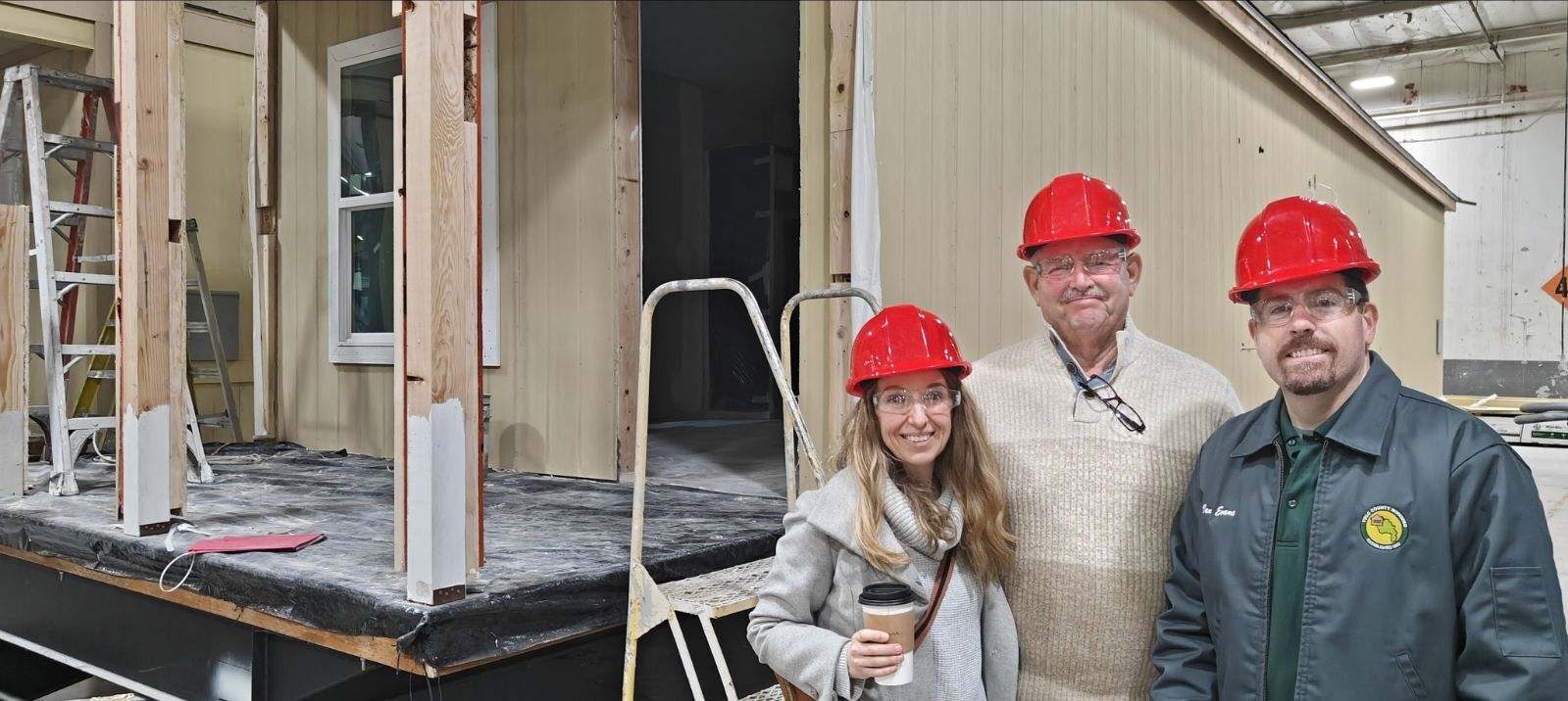 Judy in a hardhat at an affordable housing build site