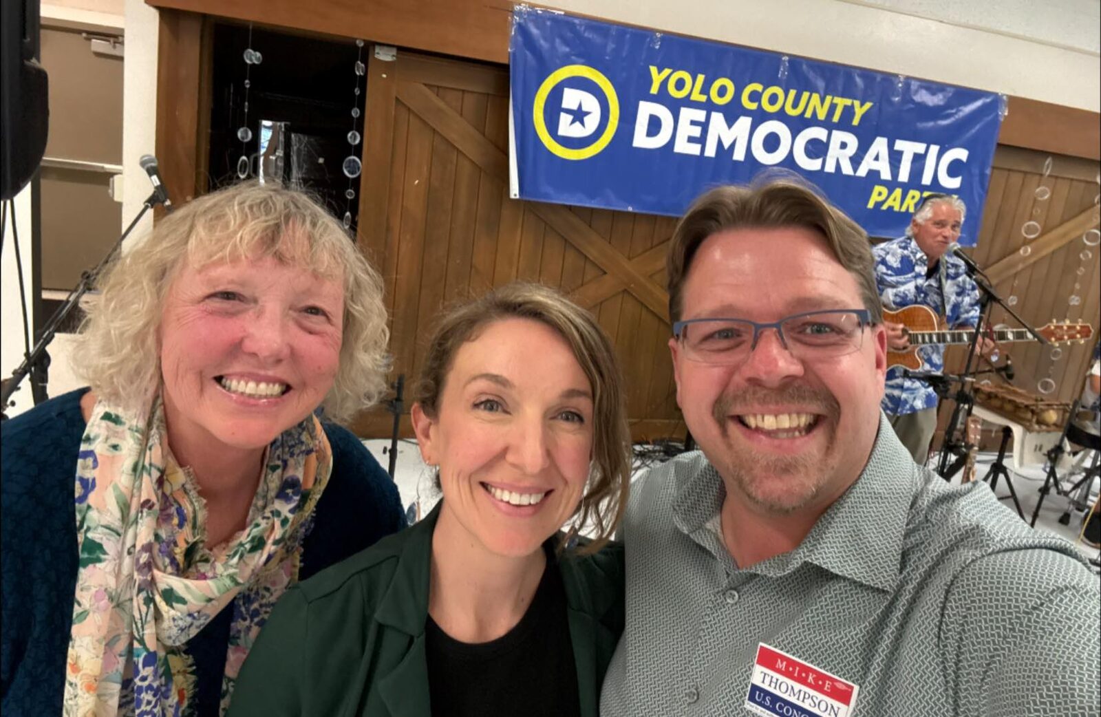 Judy with elected officials at a Yolo County Democratic Party event